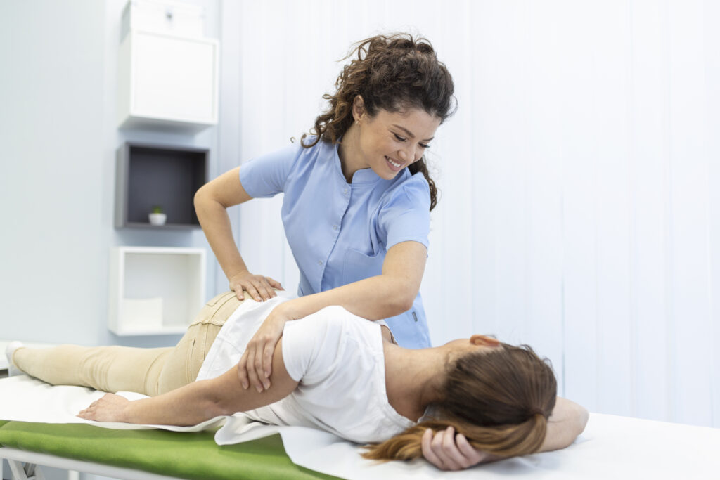 Chiropractor performing manual therapy on a patient's back