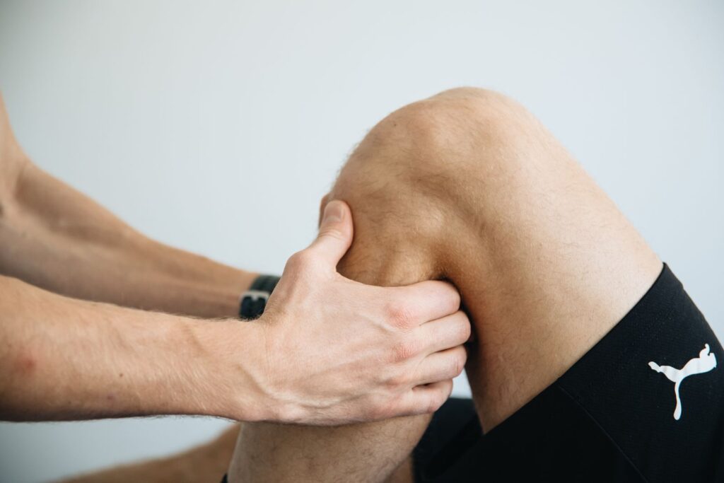 Physiotherapist treating a patient knee